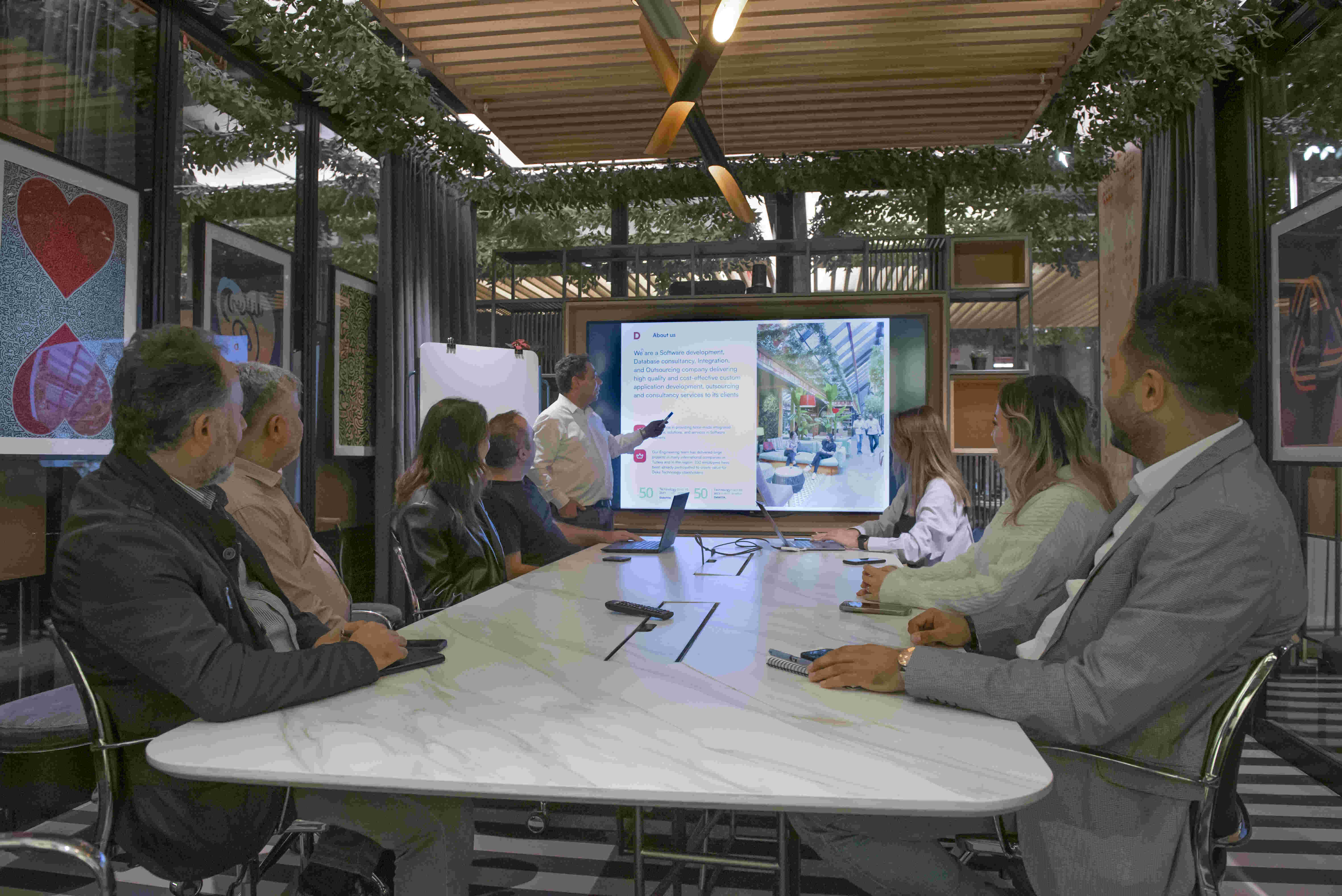 Team watching a platform demo