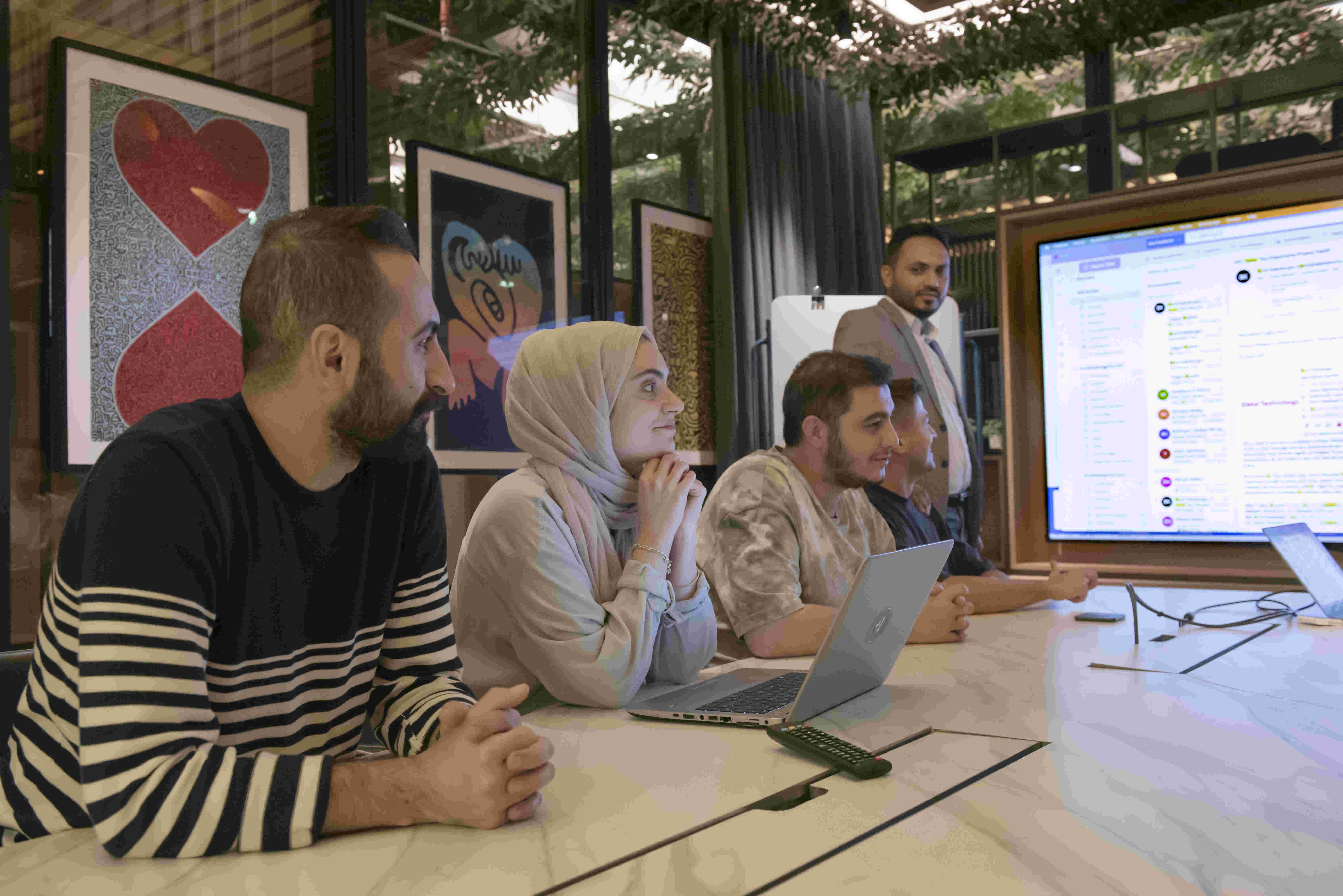 Engineers following a technical presentation